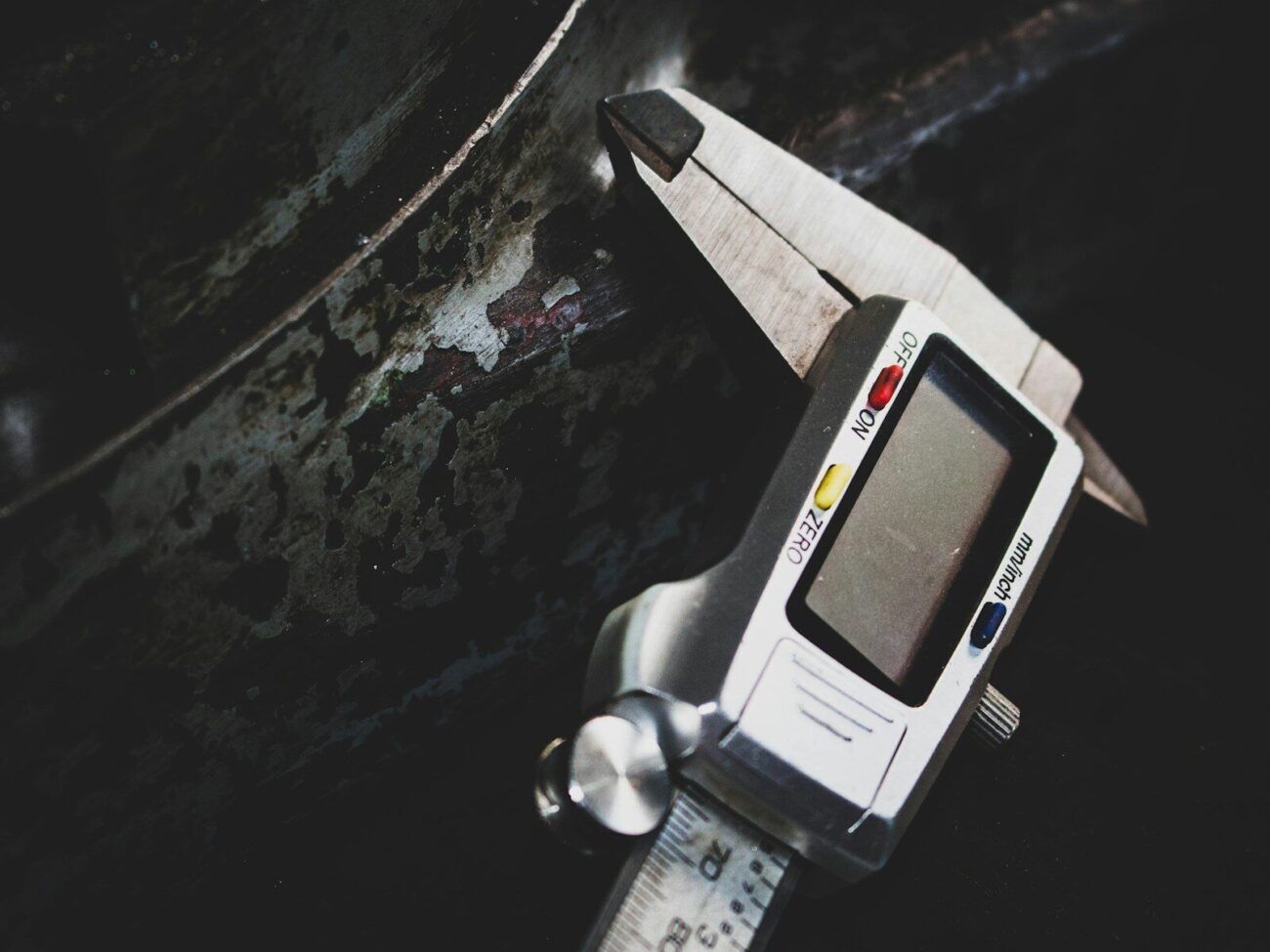 Digital caliper measuring dimensions with precise electronic readout illustrating the type of precision instrument used for stem diameter measurement in forest and ecological research.