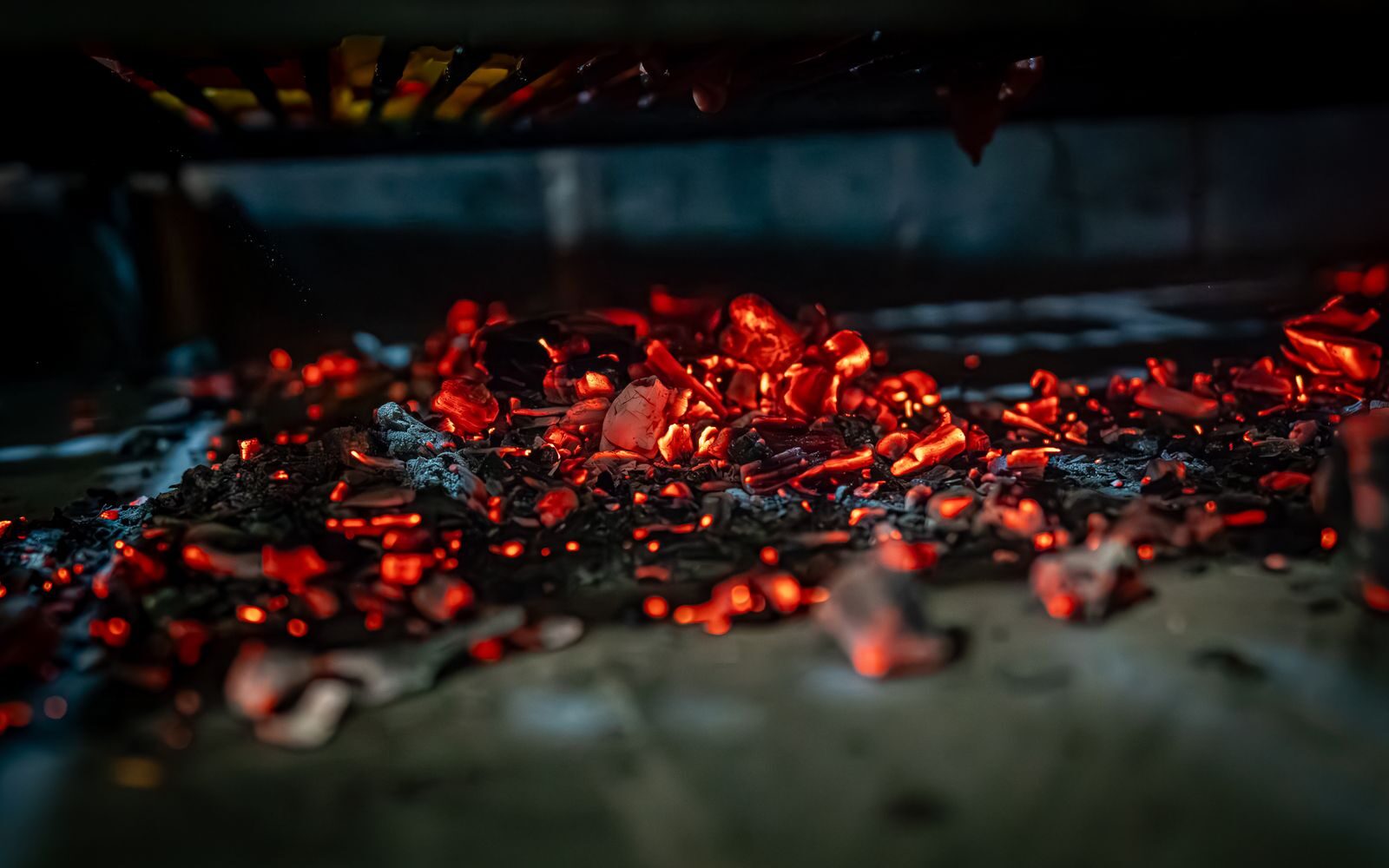 Bed of glowing red embers and coals in a fire