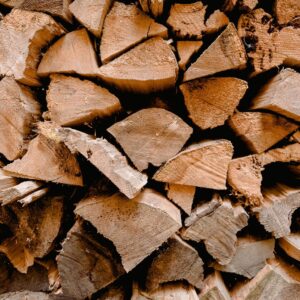 Split firewood stacked with the cut faces showing